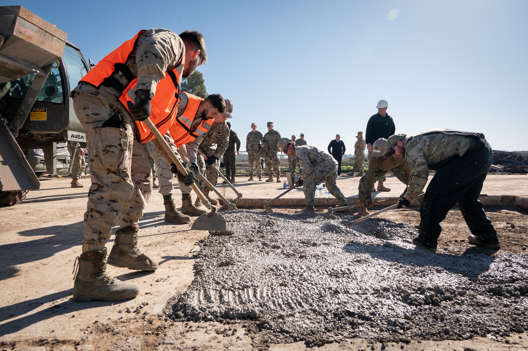 At Morón Air Base, Spain, U.S. Air Force Airmen and U.S. Navy Seabees teamed up with Spanish and Portuguese forces for an Airfield Damage Repair (ADR) exercise from February 1-8, 2025. More than just fixing runways, the training strengthened NATO partnerships, improved joint response capabilities, and enhanced real-world mission readiness. With support from Language Enabled Airman Program (LEAP) scholars, the exercise also broke communication barriers, ensuring seamless coordination among the multinational team. (U.S. Air Force photo by Cristina Oliveira)