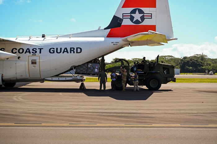 Airmen unload an HC-130J aircraft
