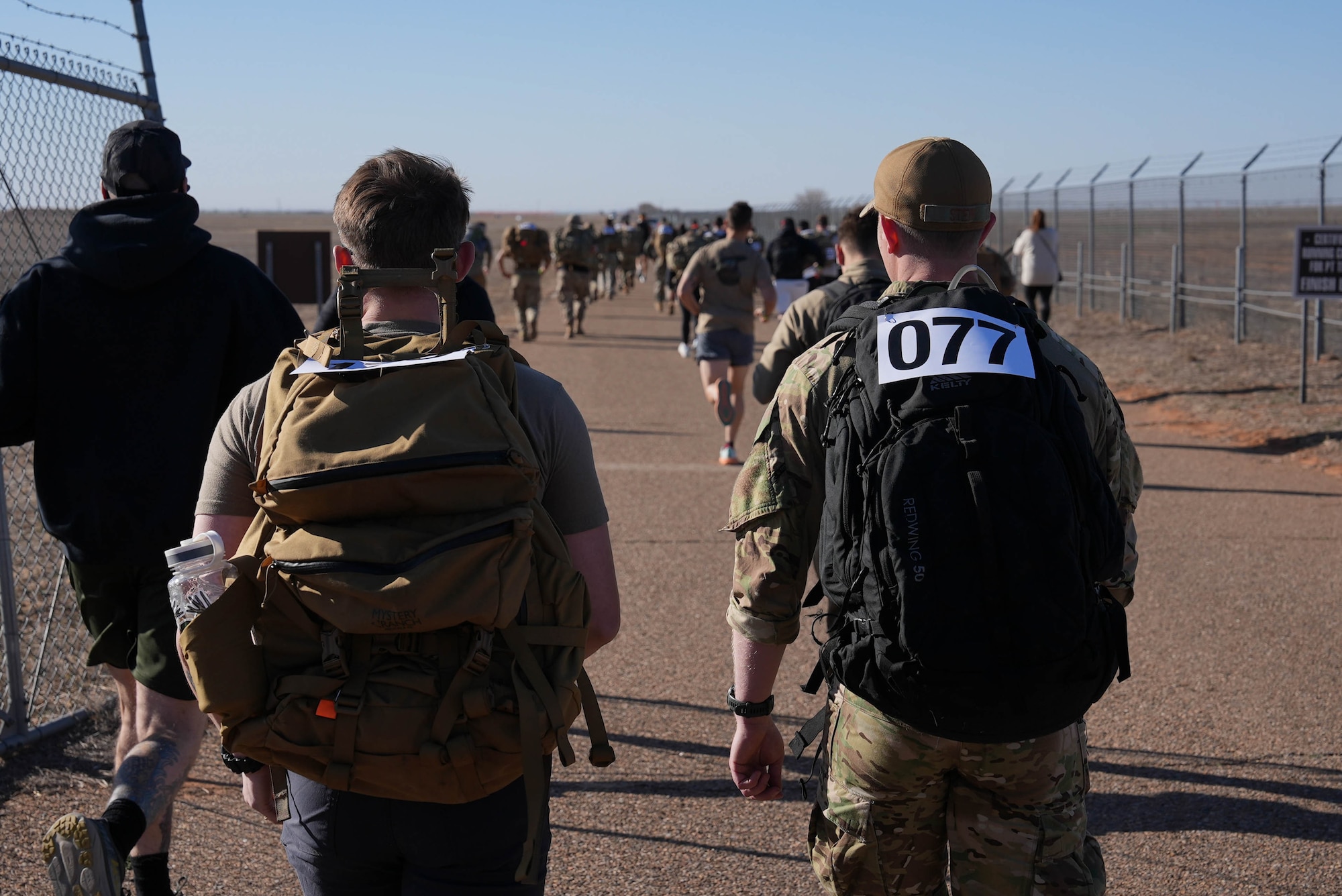 Two Airmen march in the 4th Annual Bataan Memorial March
