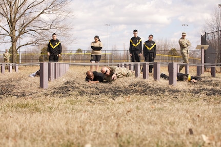 Army Brig. Gen. Leland Blanchard, adjutant general of the District of Columbia National Guard, guides soldiers from the Recruit Sustainment Program through a confidence-conditioning obstacle course at Fort Belvoir, Virginia on March 8, 2025. The Resilience Obstacle Course is designed to enhance soldiers' confidence while testing their physical, mental, and team-building skills.