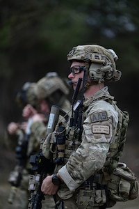 A line of armed Airmen
