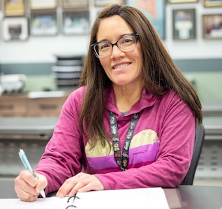 Kathy Miller, painter, Shop 71, Painters, took advantage of Command University's Tuition Assistance Program to further her education at Puget Sound Naval Shipyard & Intermediate Maintenance Facility in Bremerton, Washington. (U.S. Navy photo by Wendy Hallmark)