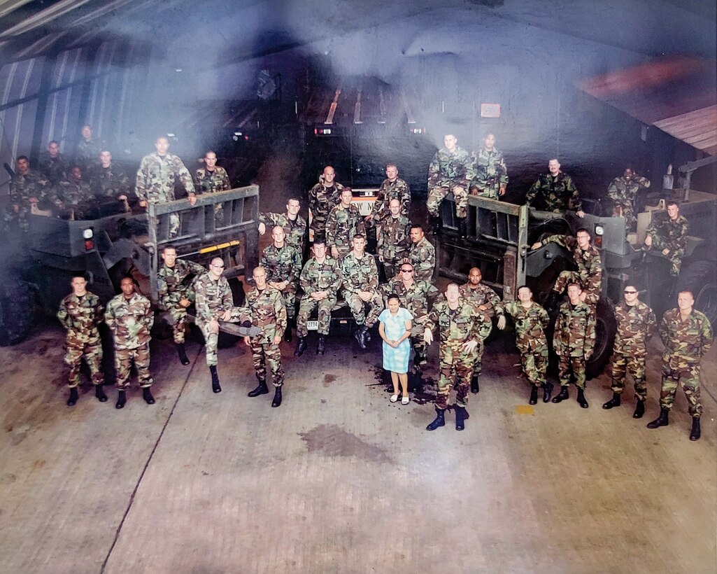 (Second from the bottom left) U.S. Air Force Master Sgt. Steven Wedlow, 612th Air Base Squadron fleet manager, poses for a photo with his unit at Soto Cano Air Base, Honduras.