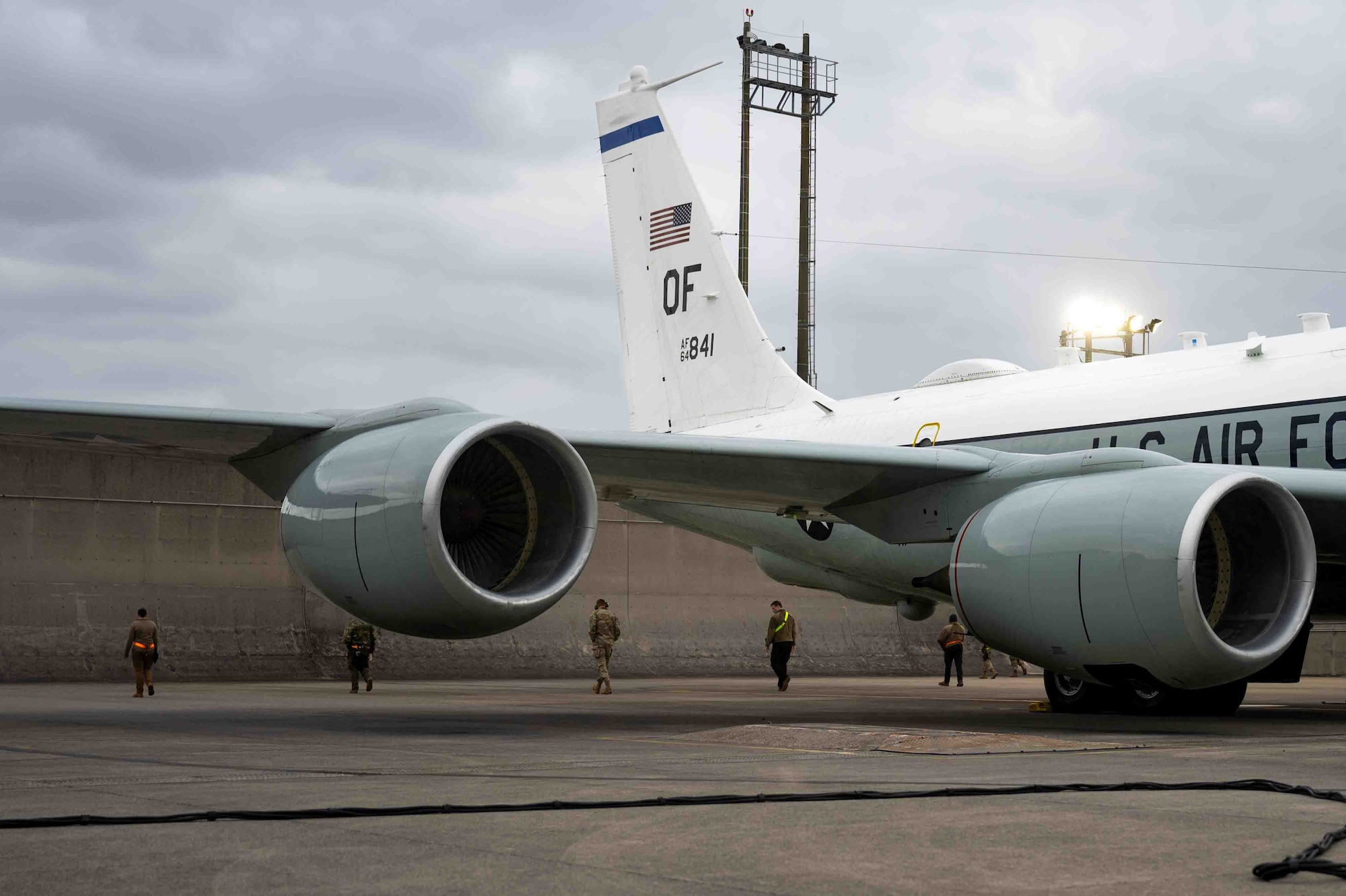 Airmen conducting a FOD walk prior to an RC-135's flight