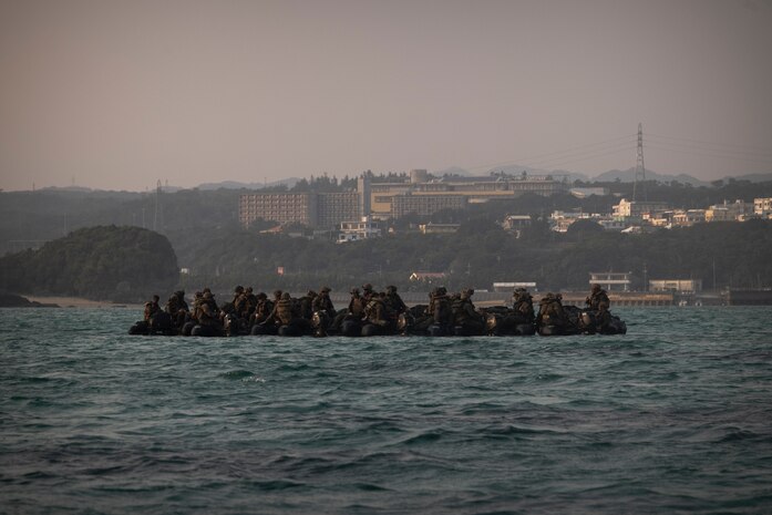 U.S. Marines with Battalion Landing Team 2/4, 31st Marine Expeditionary Unit, prepare to insert during a simulated boat raid on Recon Beach, Camp Schwab, Okinawa, Japan, Feb. 17, 2025