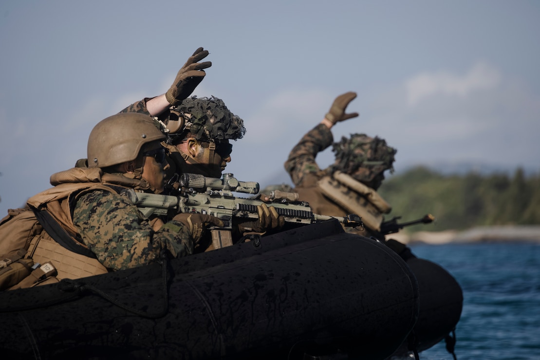 U.S. Marines with Battalion Landing Team 2/4, 31st Marine Expeditionary Unit, insert onto the beach during a bilateral simulated boat raid part of Iron Fist 25 at Kin Blue Training Area, Okinawa, Japan on Mar. 1, 2025.