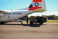 Airmen unload an HC-130J aircraft