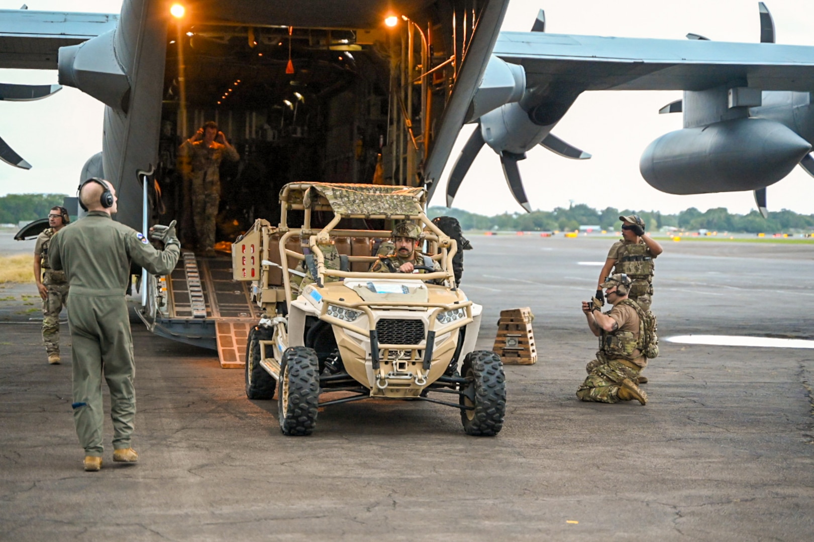 433rd Contingency Response Flight Citizen Airmen unload a tactical vehicle from a C-130J during Exercise NEXUS FORGE 2025