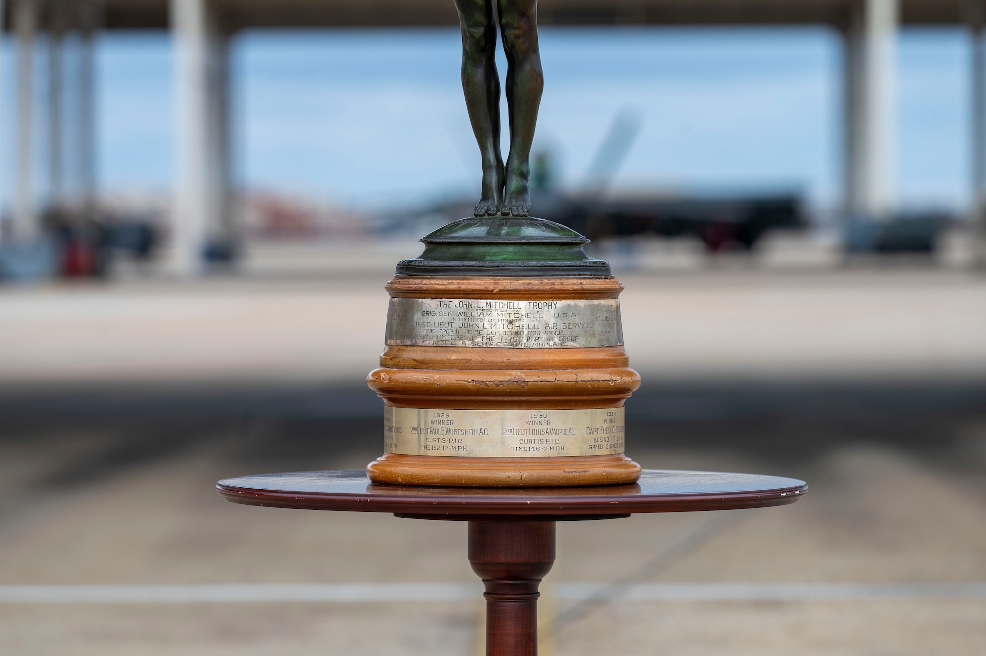 LANGLEY AIR FORCE BASE, Va. – The John Mitchell Trophy sits in front of the designated parking spot for the winner of the Mitchell Trophy Air Race at Langley Air Force Base, Virginia, Mar. 7, 2025. The trophy was rediscovered in 1998 at Seymour-Johnson Air Force Base, North Carolina. The 1st Fighter Wing reinvigorated its race with modernized aircraft, rules and eligibility requirements after its nearly 88-year hiatus. (U.S. Air Force photo by Tech. Sgt. Matthew Coleman-Foster)