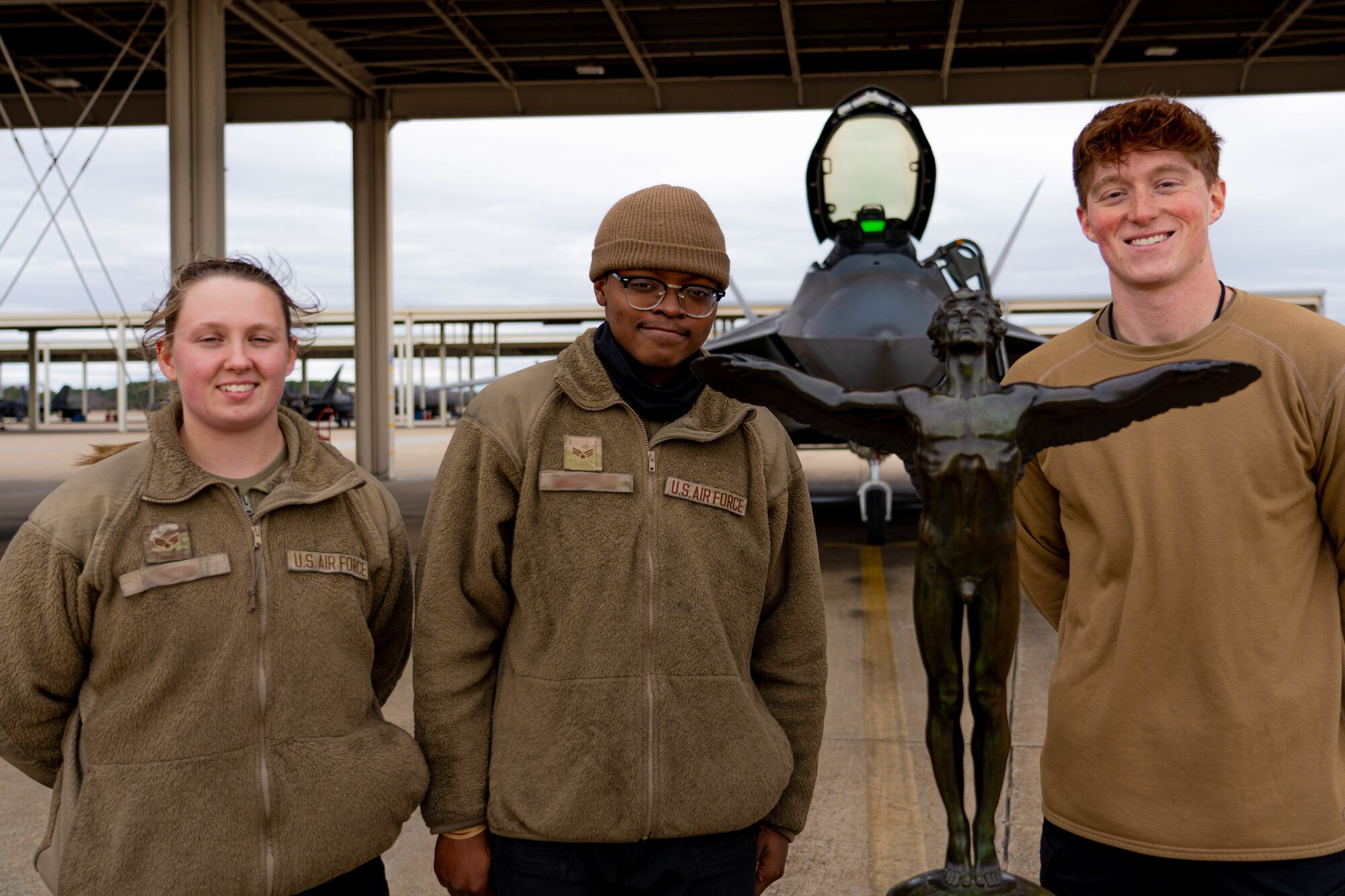 LANGLEY AIR FORCE BASE, Va. –U.S. Air Force Airmen from the 94th Fighter Generation Squadron who loaded the winning F-22 Raptor during the Mitchell Trophy Air Race pose for a photo with the John L. Mitchell trophy at the end of the rAce at Langley Air Force Base, Virginia, Mar. 6, 2025. The victory of the squadron highlighted not only their coordination skills, but also the teamwork of the squadron showing the effectiveness of integrated operations between aircrew and maintainers under realistic, stressful conditions.(U.S. Air Force photo by Staff Sgt. Michael Bowman)