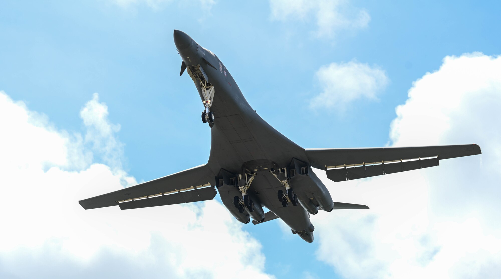 B-1B Lancer ascends into the sky after conducting a "touch and go" maneuver.