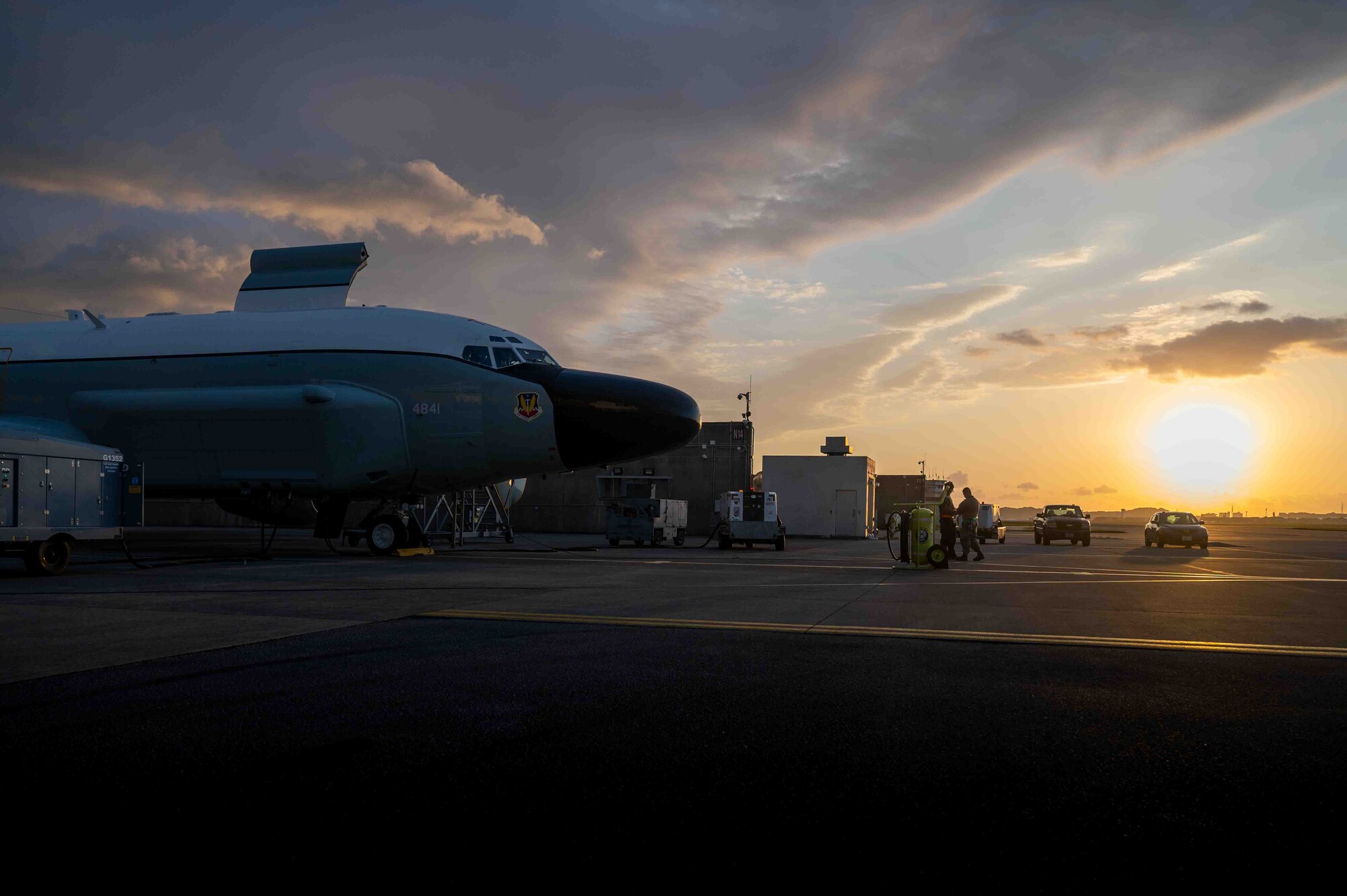 A parked RC-135 Rivet Joint photographed during a sunset