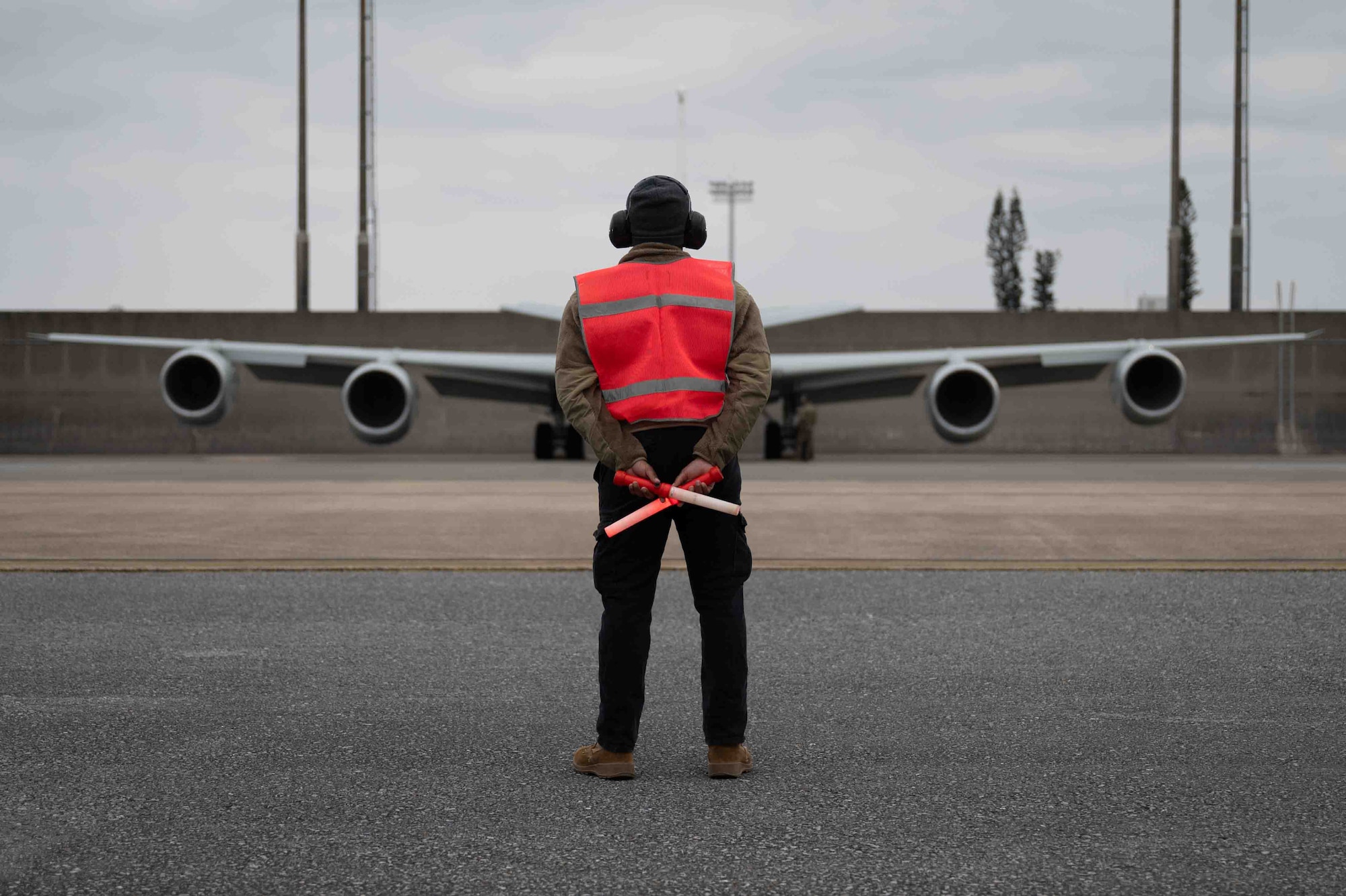 Airman marshaling an RC-135 Rivet Joint