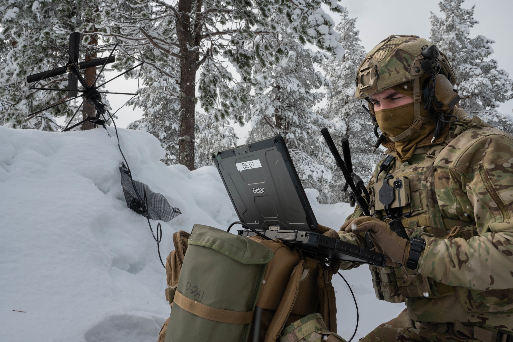 A TACP Airman uses satellite communication