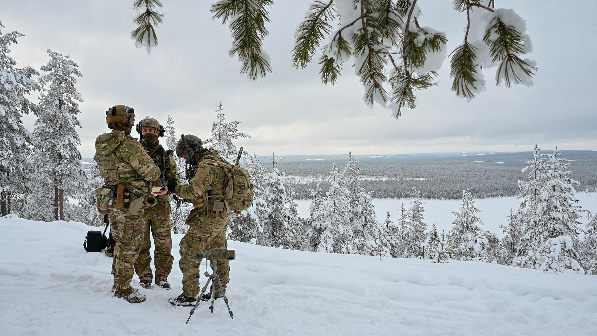 Three TACP Airmen prepare to call in close air support