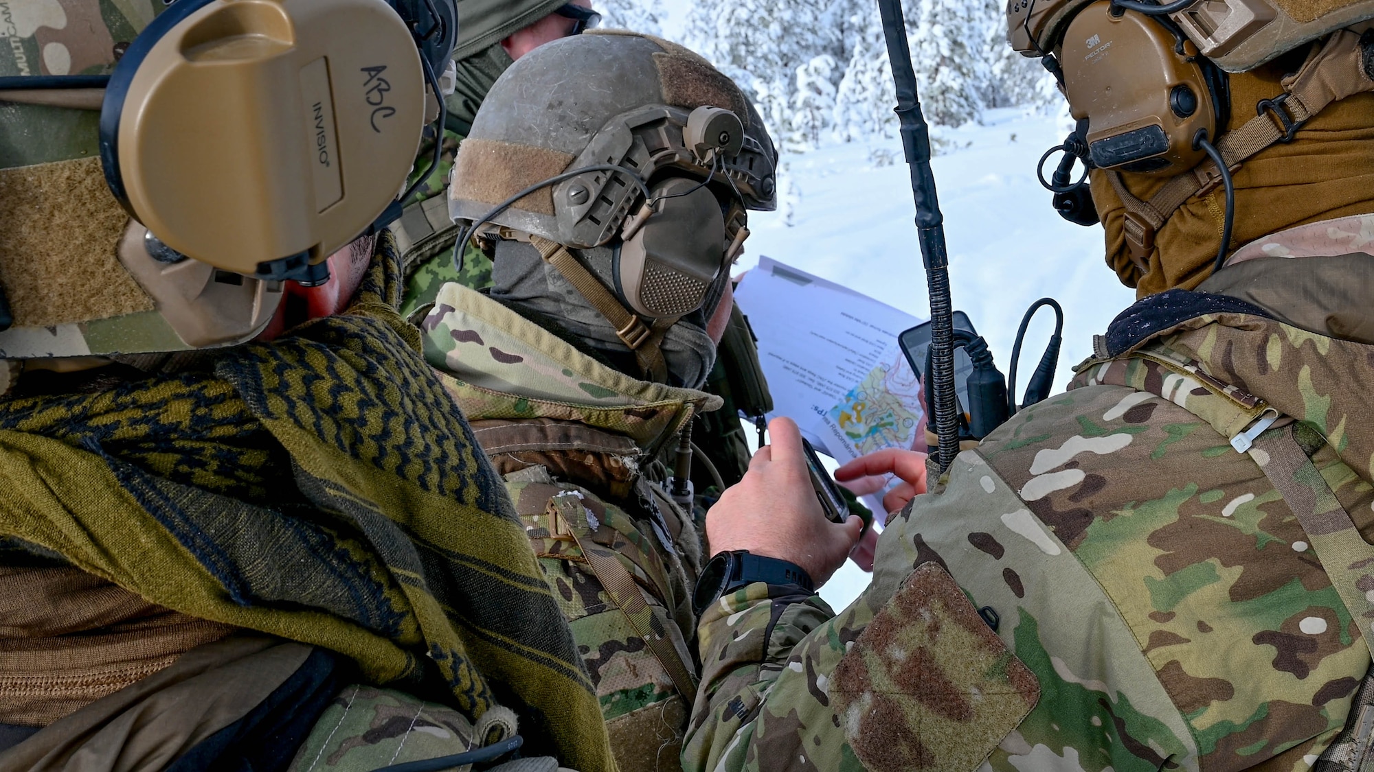 TACP Airmen look at a map