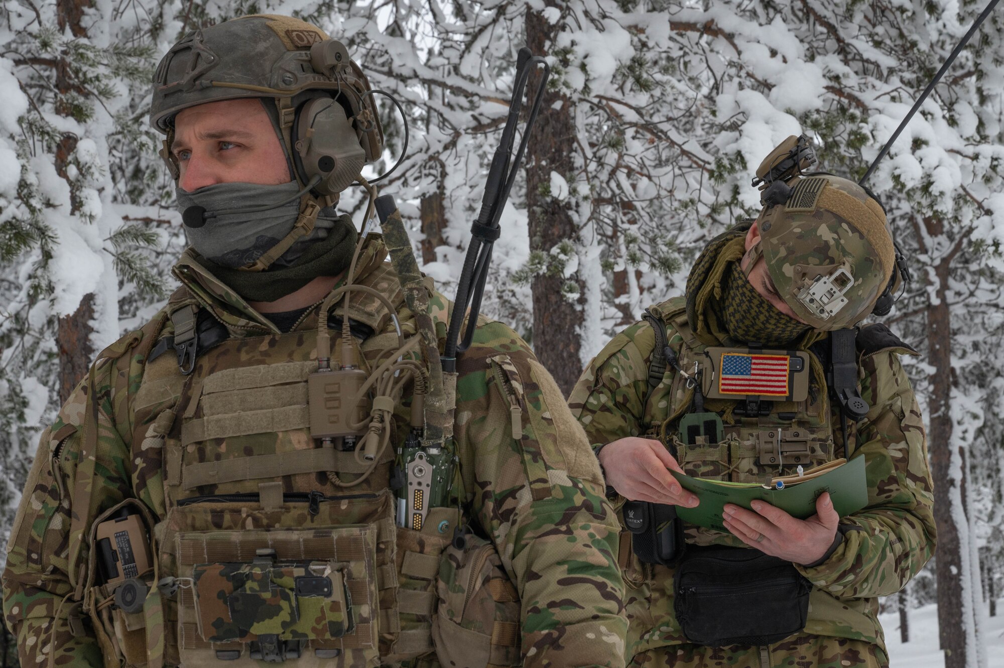 Two TACP Airmen prepare to call in close air support