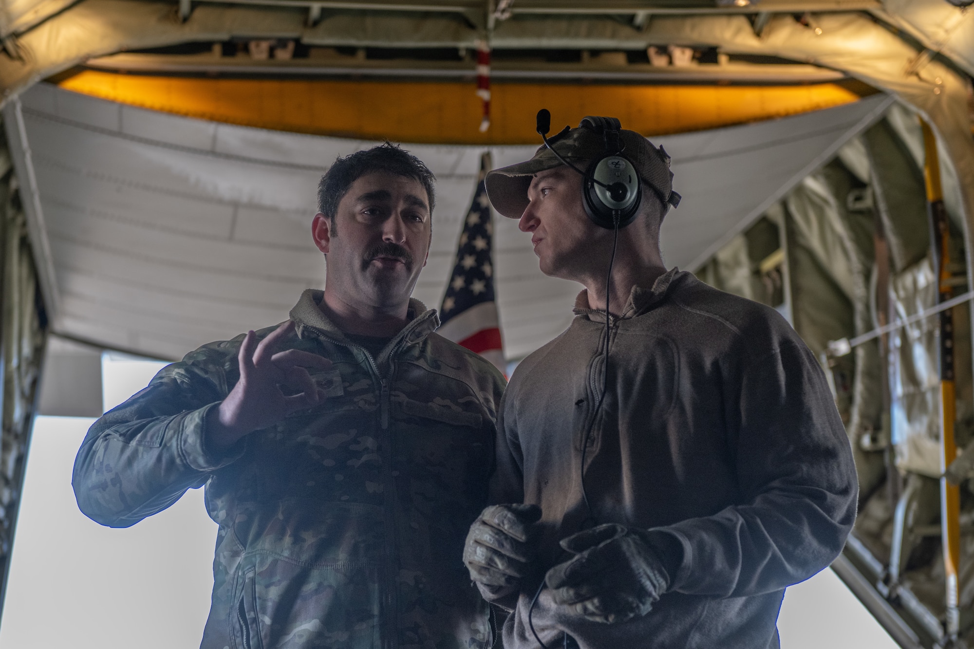 Two loadmasters are talking.