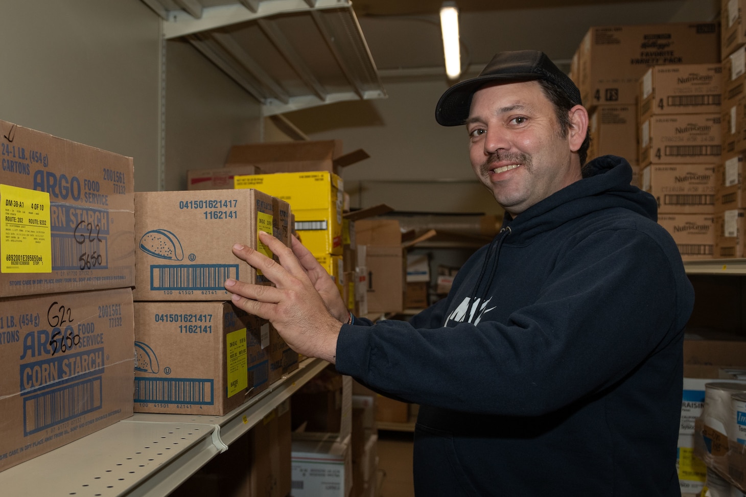 Storehouse Manager Richard LaFile, assigned to Naval Support Activity Souda Bay’s Minoan Taverna, stocks supplies in the Minoan Taverna onboard NSA Souda Bay on March 11, 2025.