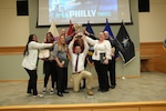 Individual Rations Branch celebrate their Team of the Year award during DLA Troop Support awards on March 11. Team members are Deana Delaire, Gregory Lichtner, Maria Pappas, Ebony Pitts, Stephen Priore, Amanda Witte, Theresa Wright and Joseph Zanolle. (Photo taken by: Ed Maldonado)