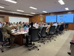 Conference room filled with people.