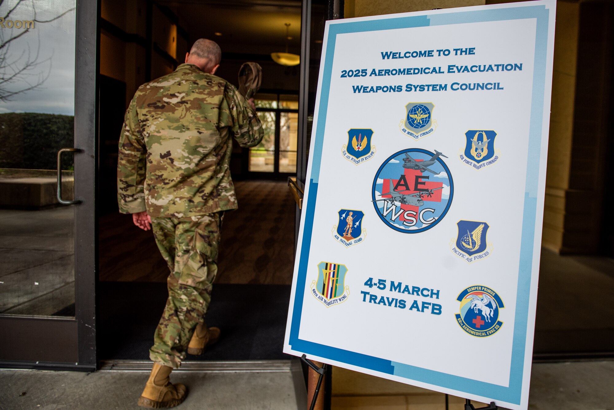 An Airman walks in to an Aeromedical Evacuation Weapons Systems council.