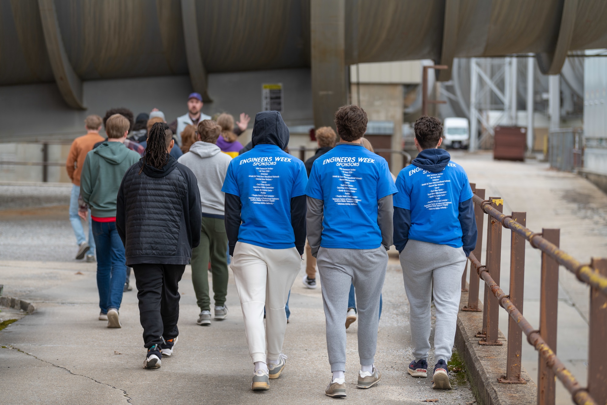 Students walk to the 4T (transonic) wind tunnel at the Propulsion Wind Tunnel facility (PWT).  As a part of the day’s activities, students were able to tour the base and learn more about facilities such as PWT. (U.S. Air Force photo by Keith Thornburgh)