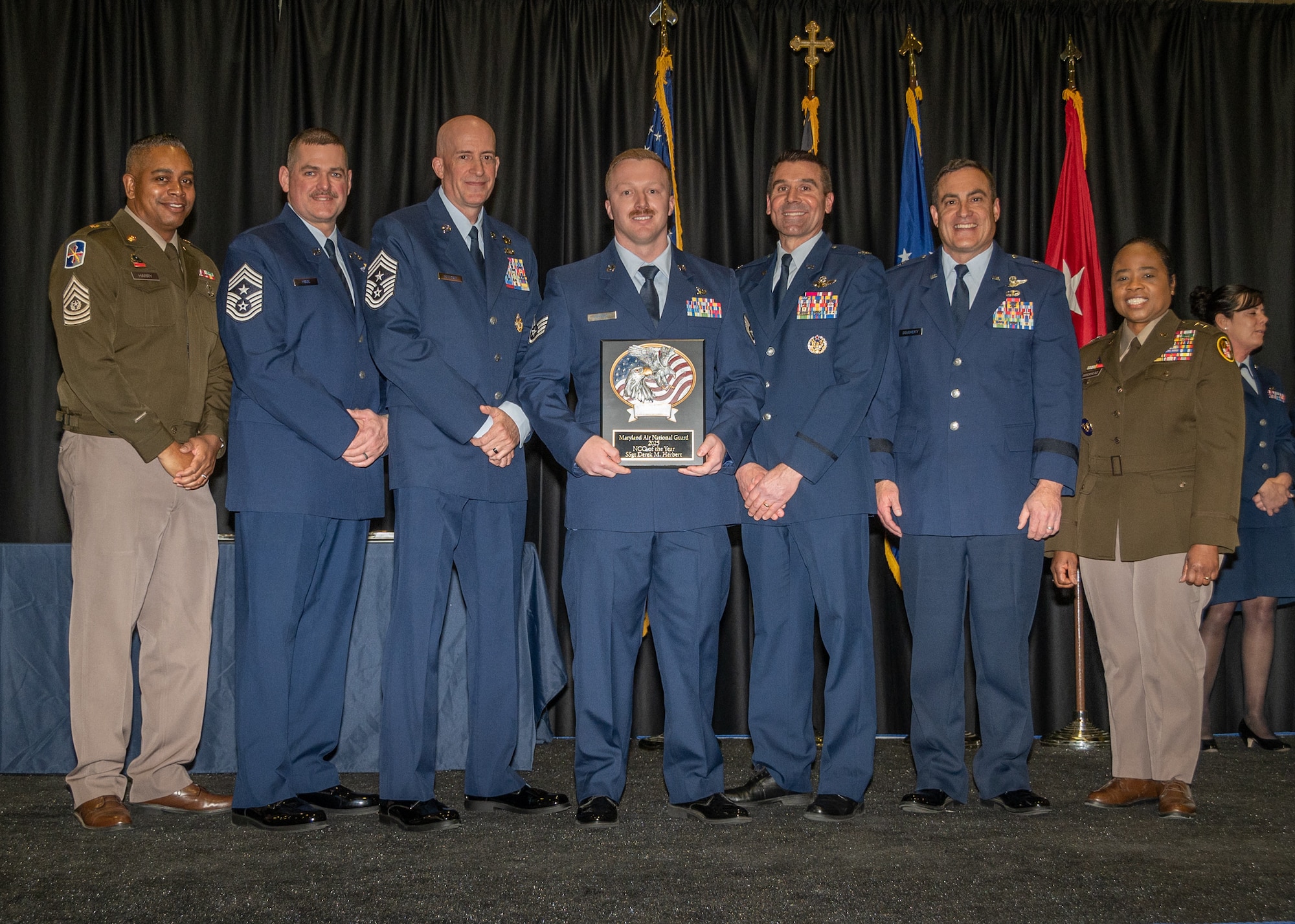 Maryland Air National Guard Staff Sgt. Derek M. Herbert, 175th Maintenance Squadron, non-commissioned officer of the year, receives a plaque during the 175th Wing’s Airman Recognition Ceremony at Warfield Air National Guard Base at Martin State Airport, Maryland, January 12, 2 025.
