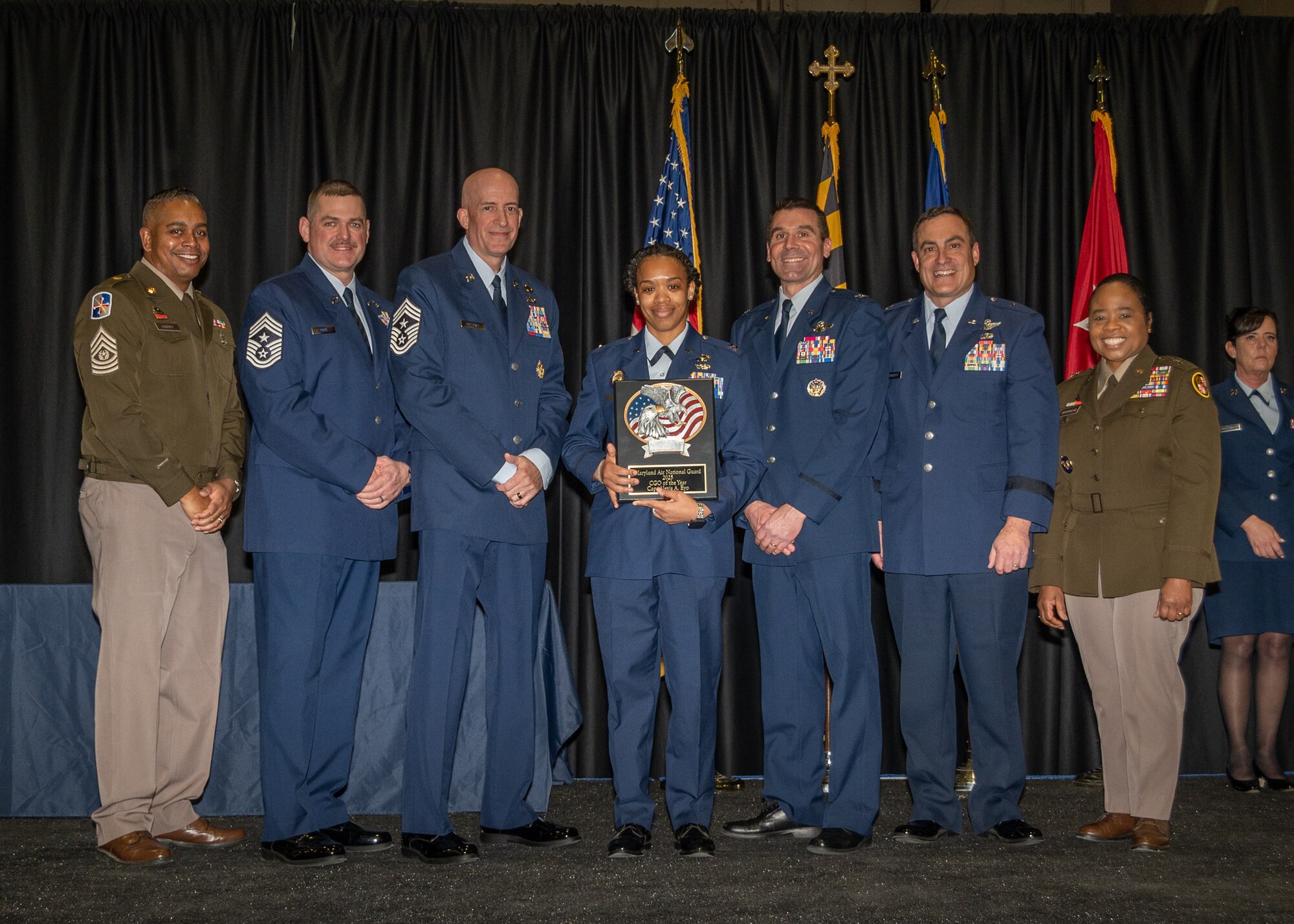 Maryland Air National Guard Capt. Alexis Eyo, 275th Operations Support Squadron, company grade officer of the year, receives a plaque during the 175th Wing’s Airman Recognition Ceremony at Warfield Air National Guard Base at Martin State Airport, Maryland, January 12, 2025.