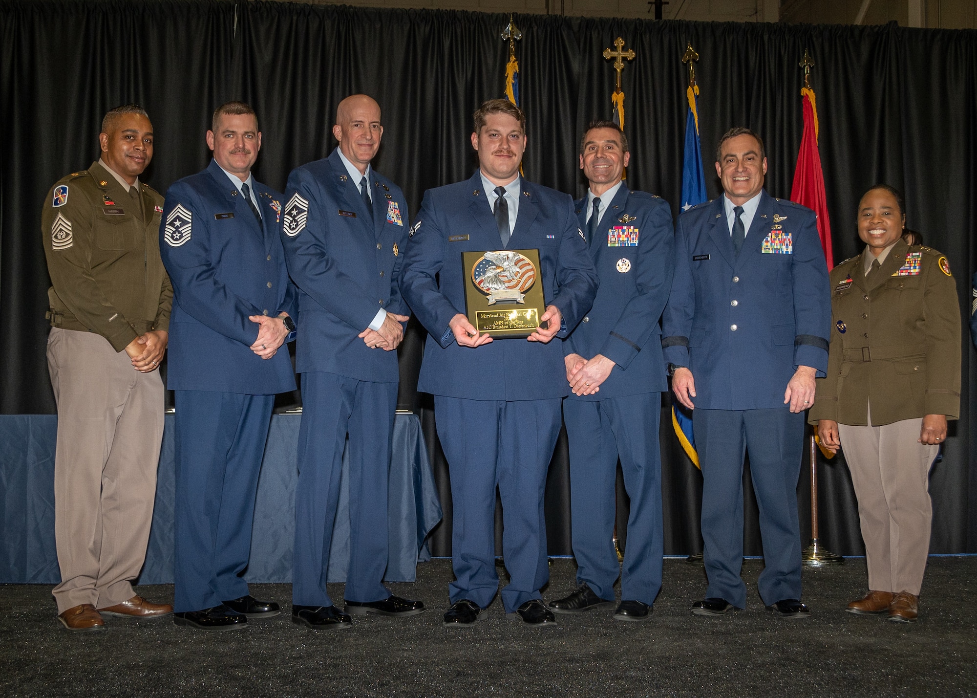 Maryland Air National Guard Airman 1st Class Brandon Diefenbach, 175th Aircraft Maintenance Squadron, airman of the year, receives a plaque during the 175th’s Wing Airman Recognition Ceremony at Warfield Air National Guard Base at Martin State Airport, Maryland, January 12, 2025.