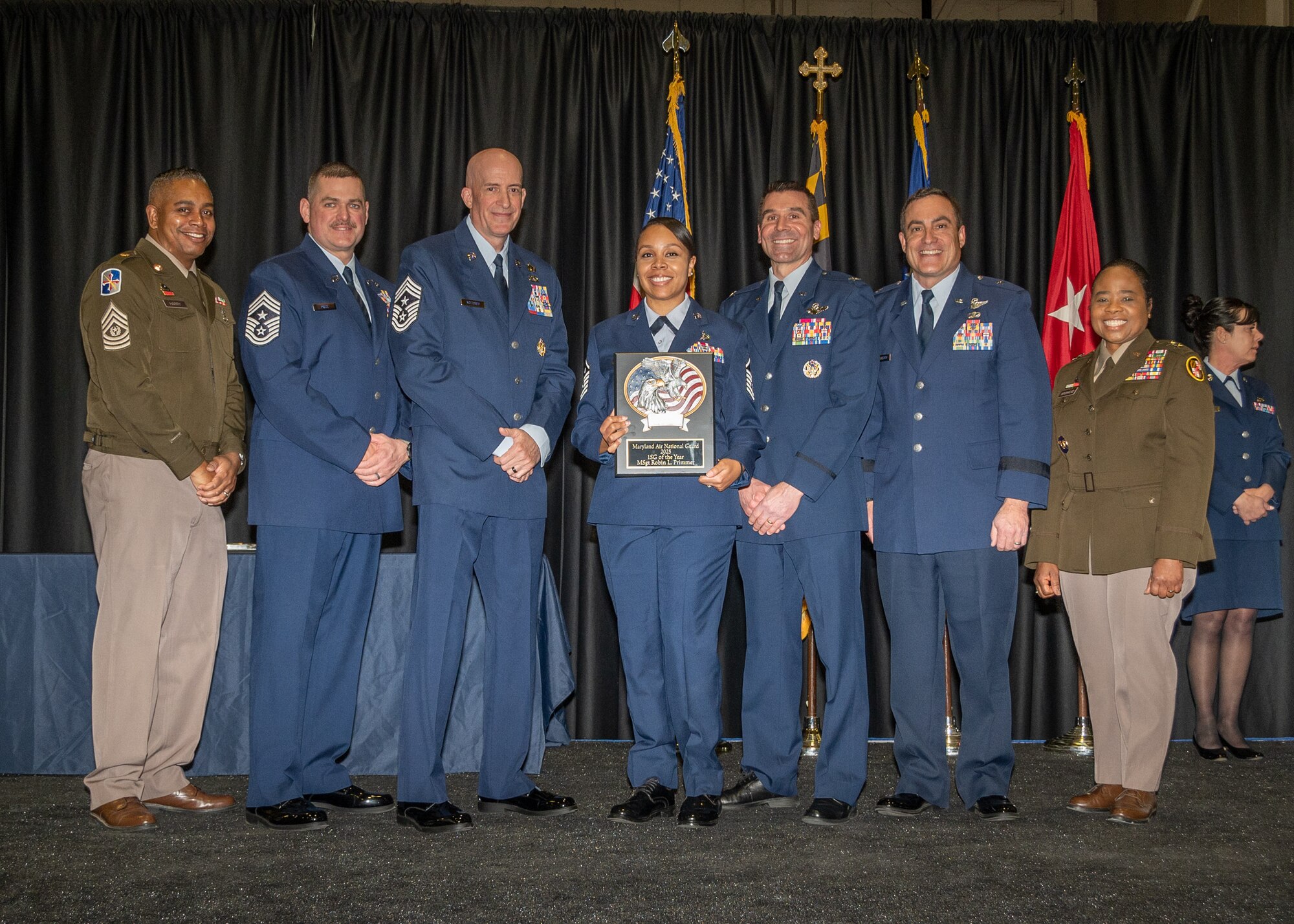 Maryland Air National Guard Master Sgt. Robin Primmer, 175th Aircraft Maintenance Squadron, outstanding airman of the year for first sergeant, receives a plaque during the 175th Wing’s Airman Recognition Ceremony at Warfield Air National Guard Base at Martin State Airport, Maryland, January 12, 2025.