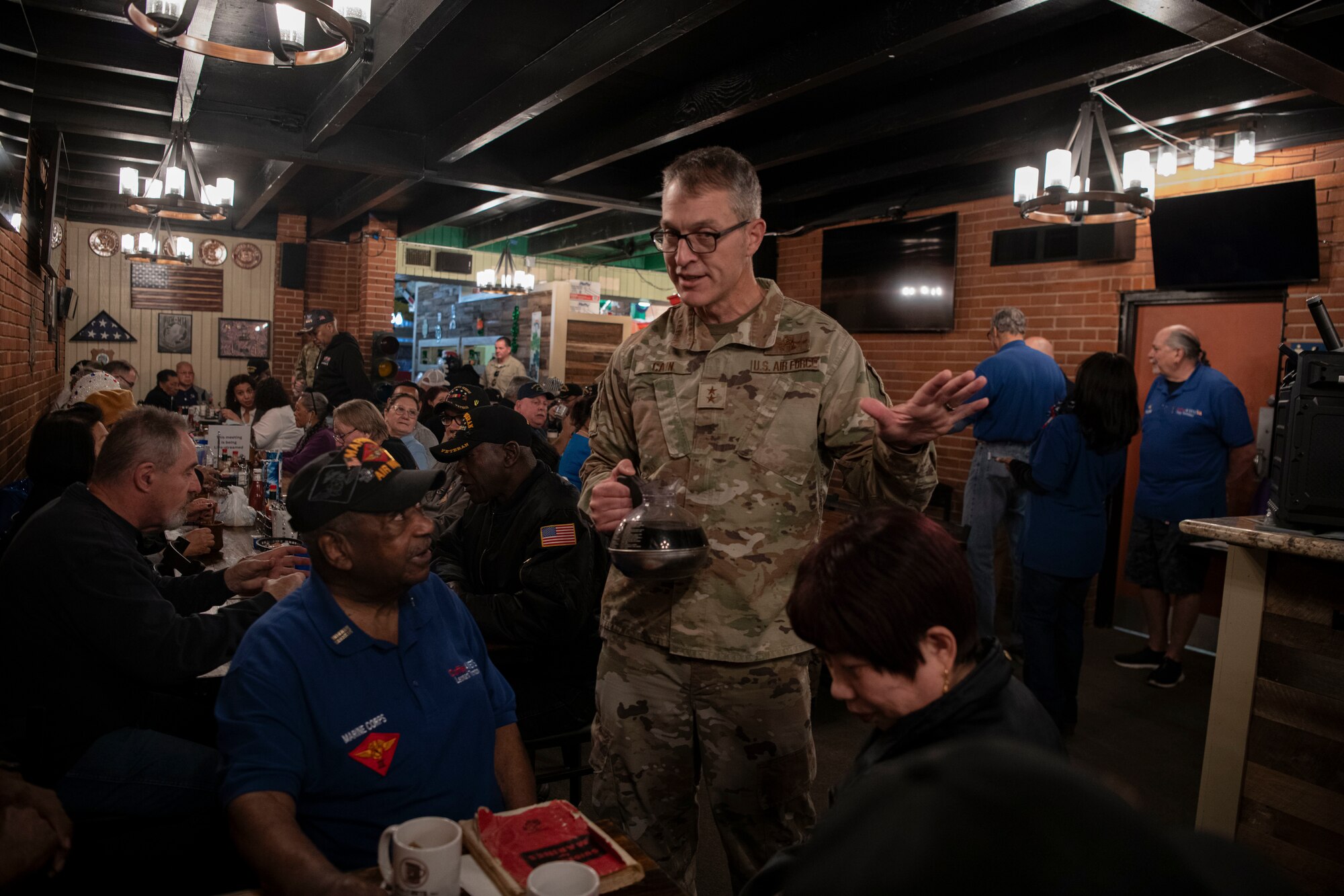 AFTC leadership engages with local veterans at Coffee4Vets event.