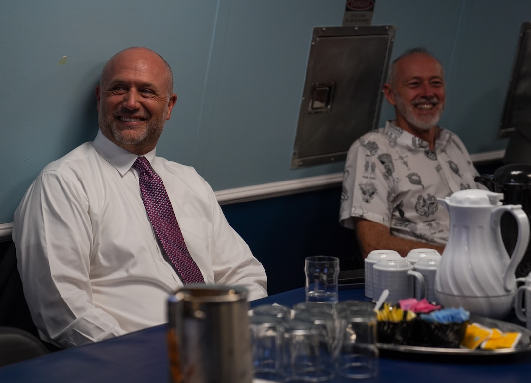 Matthew Bunt (left), the Deputy Chief of Mission at U.S. Embassy to Papua New Guinea and Peter Zwart (right), the High Commissioner of New Zealand to Papua New Guinea, listen to a brief in the wardroom of the Coast Guard Cutter Midgett (WMSL 757) in Port Moresby, Papua New Guinea, Mar. 6, 2025. Midgett is deployed to Oceania to advance relationships with partner nations to build a more free, open and resilient region. (U.S. Coast Guard photo by Petty Officer 3rd Class Jennifer Nilson)