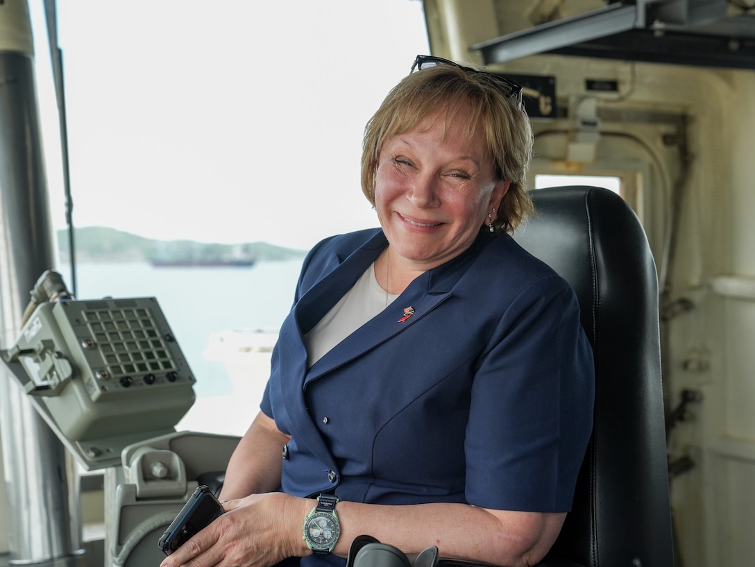 Ambassador Ann Marie Yastishock, the U.S. Ambassador to Papua New Guinea, sits in the captain’s chair on the bridge of the Coast Guard Cutter Midgett (WMSL 757) Mar. 6, 2025. A secure and prosperous Pacific requires working closely with committed partners, such as Papua New Guinea, to promote maritime governance through an international rules-based order. (U.S. Coast Guard photo by Petty Officer 3rd Class Jennifer Nilson)