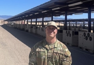 An Airman standing in the desert.