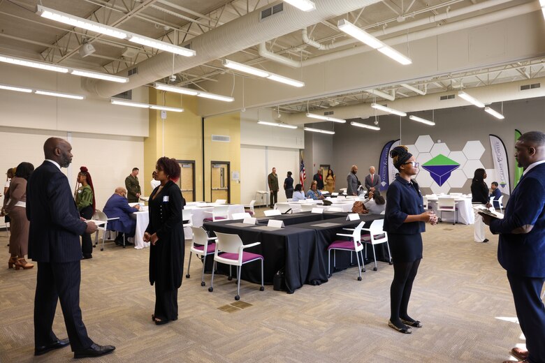 Sgt. Maj. Frank B. Kammer, sergeant major, Marine Corps Logistics Base Albany, alongside Col. Scott A. Clippinger, chief of staff, Marine Corps Logistics Command, joined other community leaders for the ninth annual handshake competition at Commodore Conyers College and Career Academy, March 12.