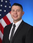 Elvis Acosta, acting technical director of Naval Surface Warfare Center, Corona Division, poses for an official portrait in Norco, Calif.