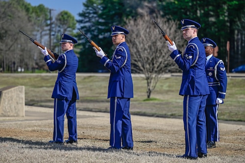 Base honor guard members fire a three-volley salute during a remembrance ceremony at Little Rock Air Force Base, Arkansas, March 12, 2025. Capt. Richard Couture and Capt. Kevin Kelleher were two of six fallen Airmen from a flight with the call sign Ivory 77, a 62nd Tactical Airlift Squadron training sortie that crashed on March 12, 1985.