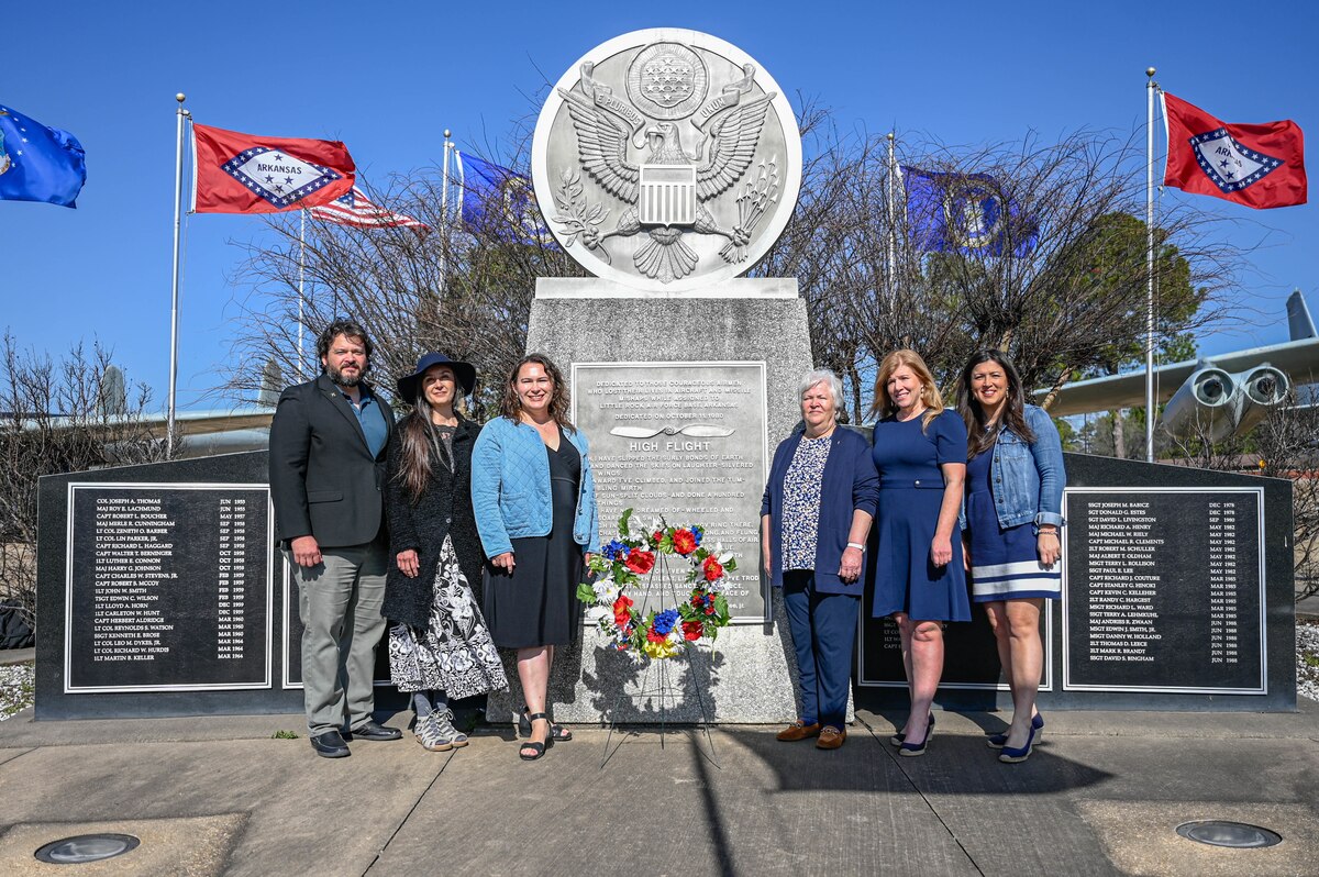 Family members pose in front of the High Flight Memorial during a remembrance ceremony at Little Rock Air Force Base, Arkansas, March 12, 2025. The 314th Airlift Wing hosted the ceremony to commemorate the 40th anniversary of a tragic C-130E Hercules accident which took the lives of six Airmen.