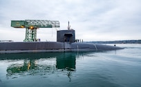USS Ohio (SSGN 726) passes the Hammerhead Crane as the nuclear-powered guided-missile submarine departs from Pier 5, at Puget Sound Naval Shipyard & Intermediate Maintenance Facility in Bremerton, Washington, Dec. 19, 2024. Ohio returned to the fleet after completing a three-year Major Maintenance Period availability at PSNS & IMF (U.S. Navy photo by Wendy Hallmark)