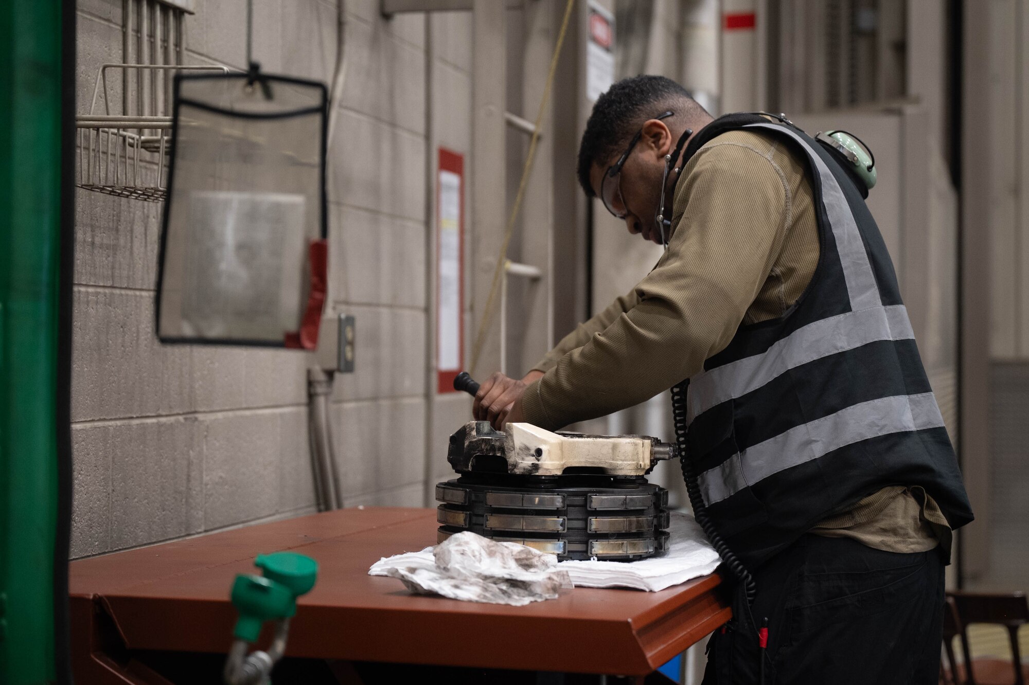 U.S. Air Force Senior Airman Johnathan Ostroski, 18th Fighter Generation Squadron crew chief, services a brake pad for an F-16 Fighting Falcon at Eielson Air Force Base, Alaska, March 3, 2025.