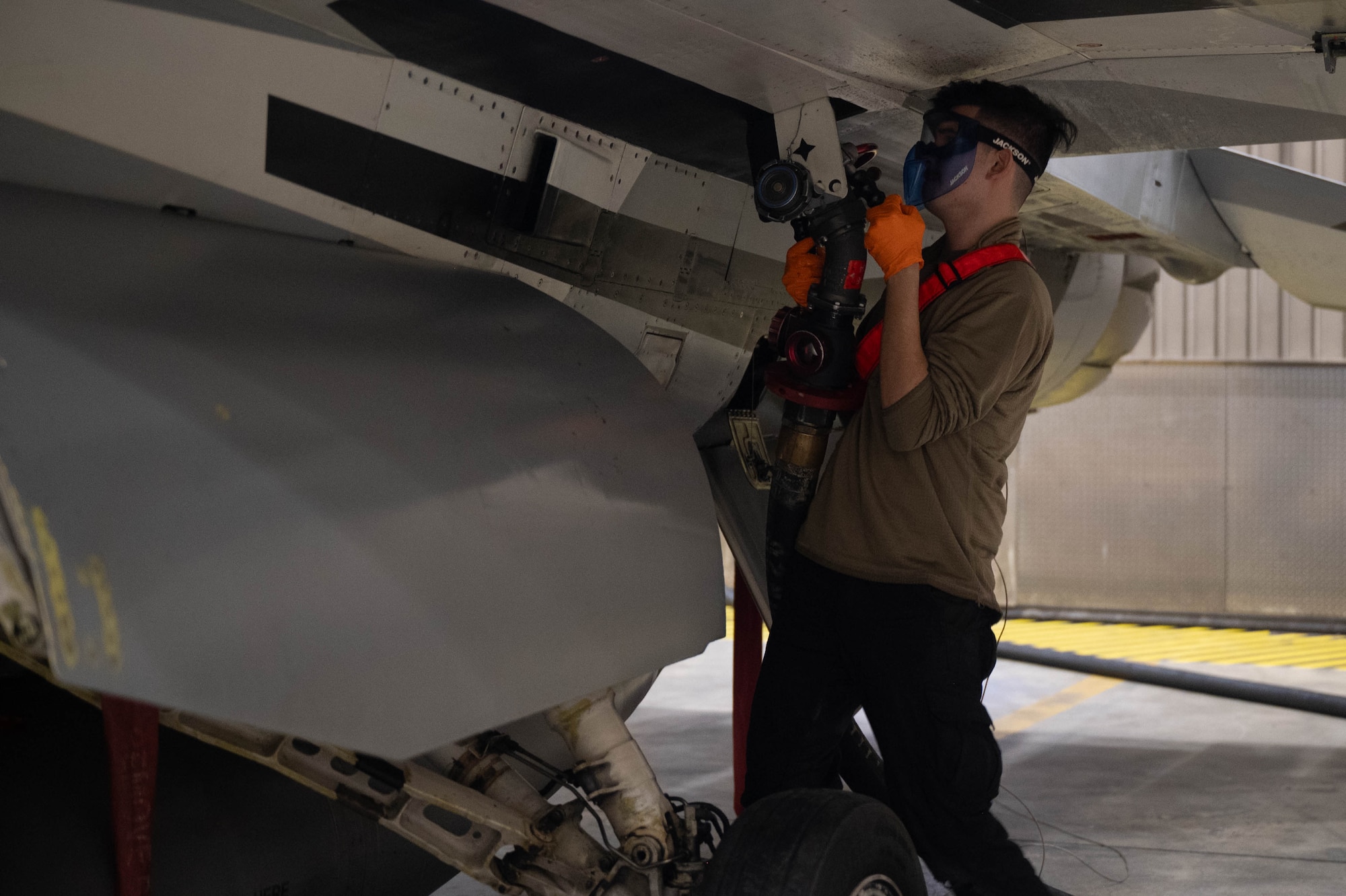 U.S. Air Force Senior Airman Christopher Ramirez, 18th Fighter Generation Squadron crew chief, refuels an F-16 Fighting Falcon after landing at Eielson Air Force Base, Alaska, March 3, 2025.