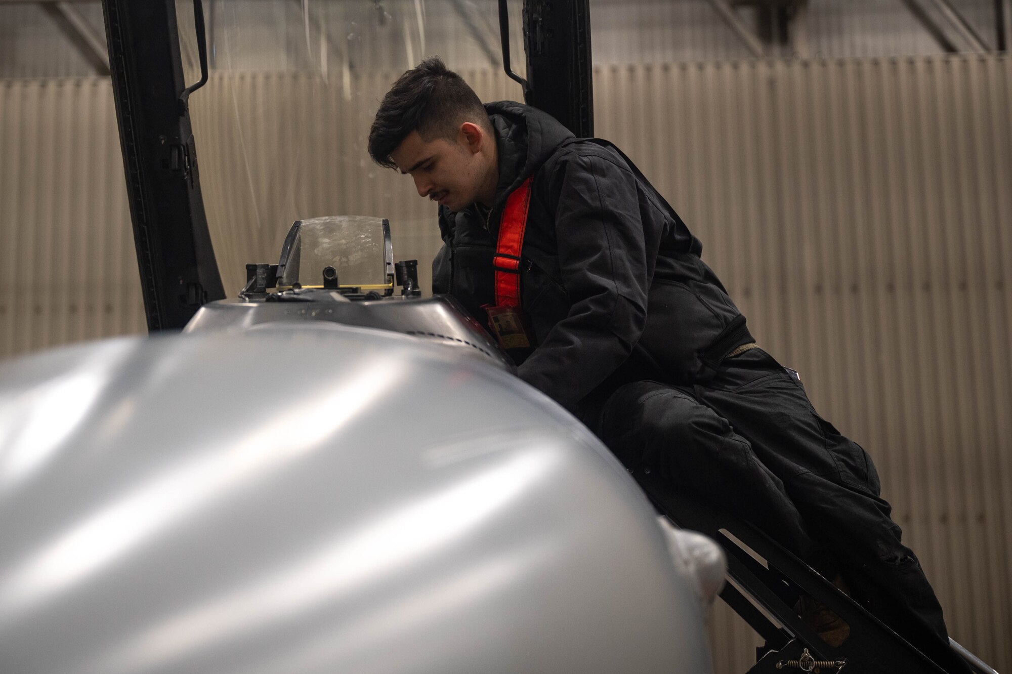 U.S. Air Force Senior Airman Christopher Ramirez, 18th Fighter Generation Squadron crew chief, checks the cockpit of an F-16 Fighting Falcon after landing at Eielson Air Force Base, Alaska, March 3, 2025.