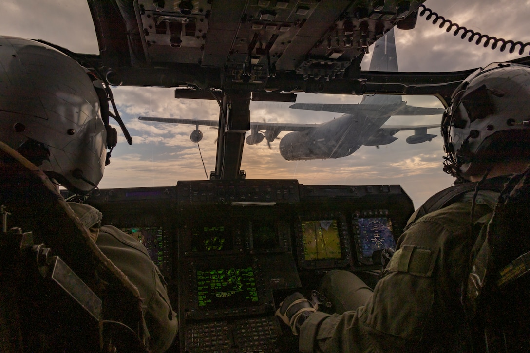 U.S. Marine Corps pilots with Marine Medium Tiltrotor Squadron (VMM) 262 (Rein.), 31st Marine Expeditionary Unit, receive a refuel in an MV-22B Osprey assigned to VMM-262 (Rein.) from a C-130H, during aerial refuel operations in support of Iron Fist 25, off the coast of Japan, Feb. 21, 2025. Iron Fist is an annual bilateral exercise designed to increase interoperability and strengthen the relationships between the U.S. Marine Corps, U.S. Navy and Japan Ground Self-Defense Force. The 31st MEU, the Marine Corps’ only continuously forward-deployed MEU, provides a flexible and lethal force, ready to perform a wide range of military operations as the premiere crisis response force in the Indo-Pacific region. (U.S. Marine Corps photo by Sgt. Tyler Andrews)