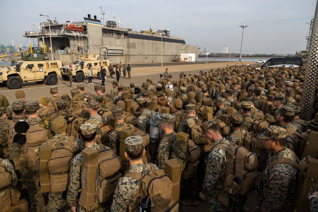 U.S. Marines and Sailors from III Marine Expeditionary Force units muster after disembarking the High-Speed Transport ship USNS Guam (T-HST-1) during a 3rd Marine Logistics Group offload operation as part of Freedom Banner 25 at Pohang Port, South Korea, March 1, 2025. 3rd MLG offloaded and transported approximately 900 Marines and Sailors with III MEF units along with vehicles and logistical equipment from the HST in a single day, inprocessing the forces pier-side before travel to various locations across South Korea to join previously-staged forces in preparation for the Korean Marine Exchange Program training evolution. This year’s U.S./Republic of Korea training exercises have more U.S. Marine Corps personnel training with their ROK allies in-country than in the past seven years, speaking to the importance of strengthening warfighting and contingency response capabilities between the two countries. Freedom Banner 25 is a Maritime Prepositioning Force exercise where 3rd MLG offloads equipment and provides support to III MEF units training throughout South Korea, testing and validating 3rd MLG’s ability to conduct integrated logistics operations in complex environments. (U.S. Marine Corps photo by Gunnery Sgt. Jonathan G. Wright)