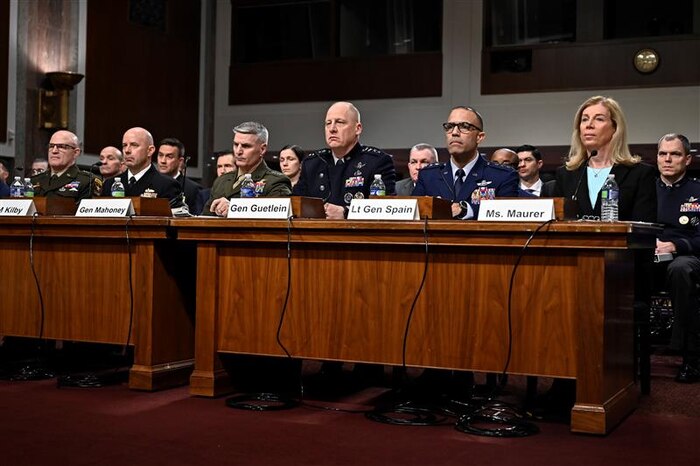 Service members speak at hearing.