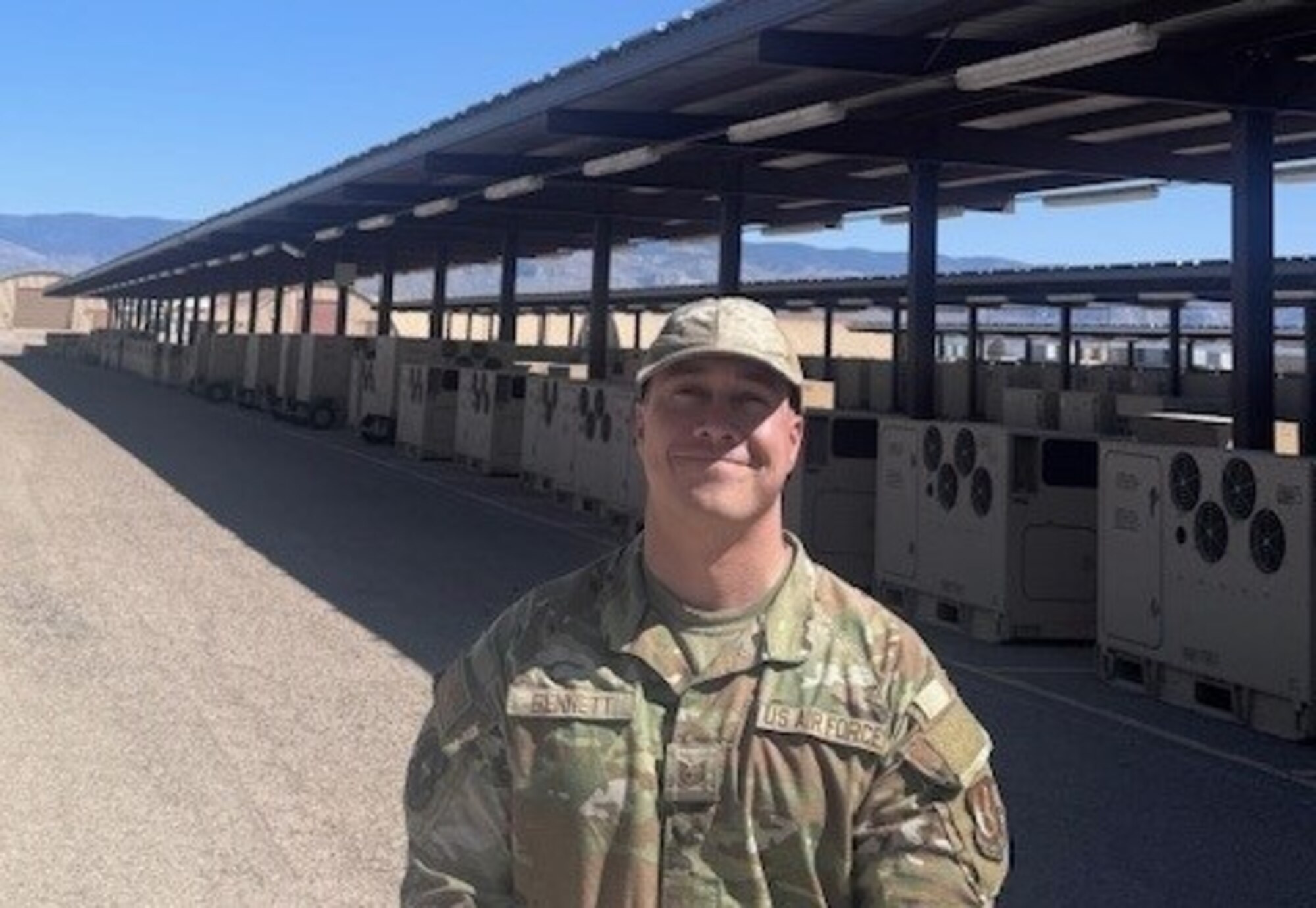 An Airman standing in the desert.