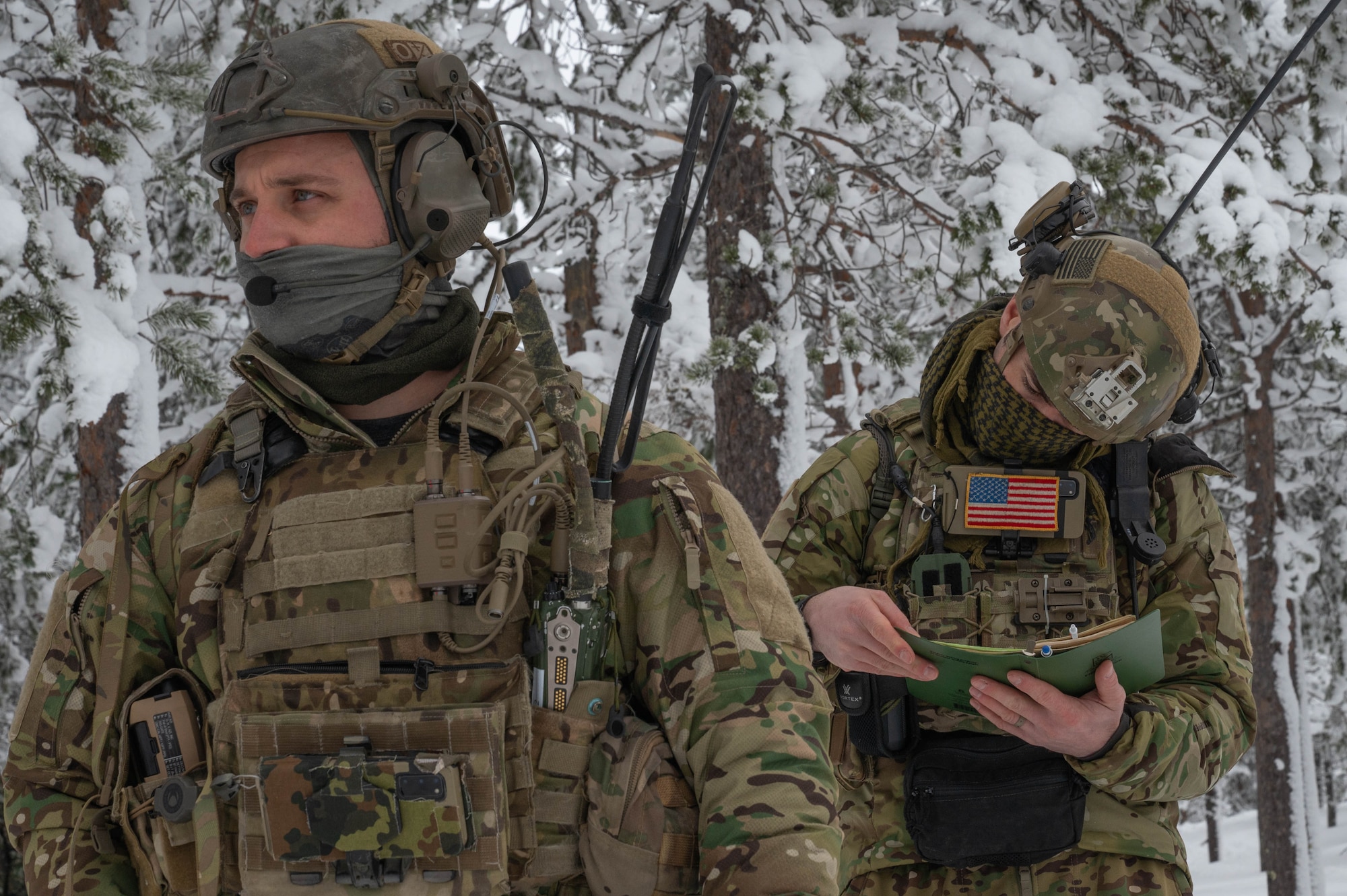 Two TACP Airmen prepare to call in close air support