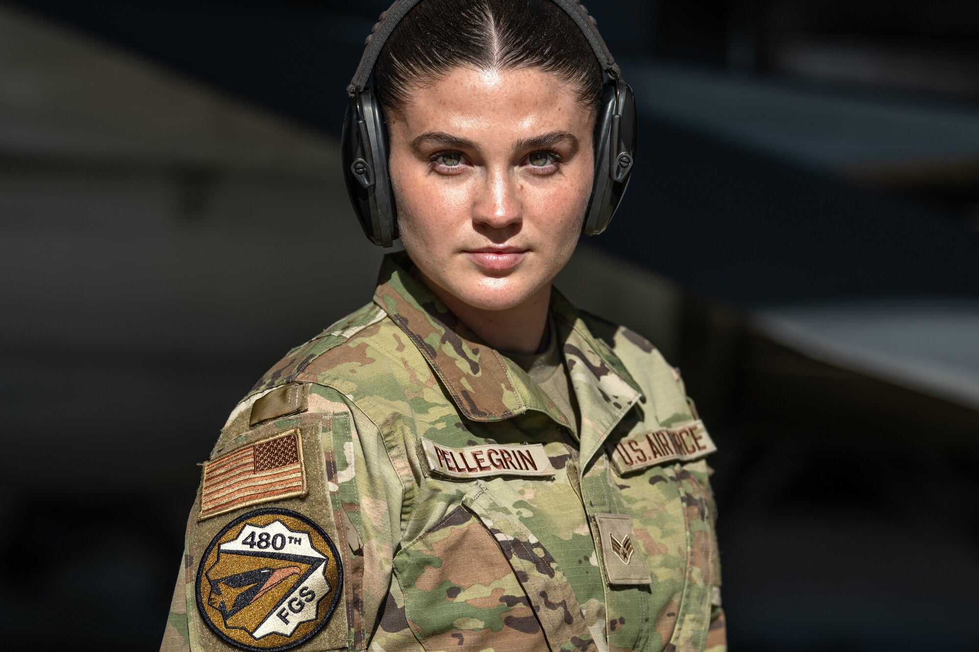 A U.S. Airman looks straight ahead.
