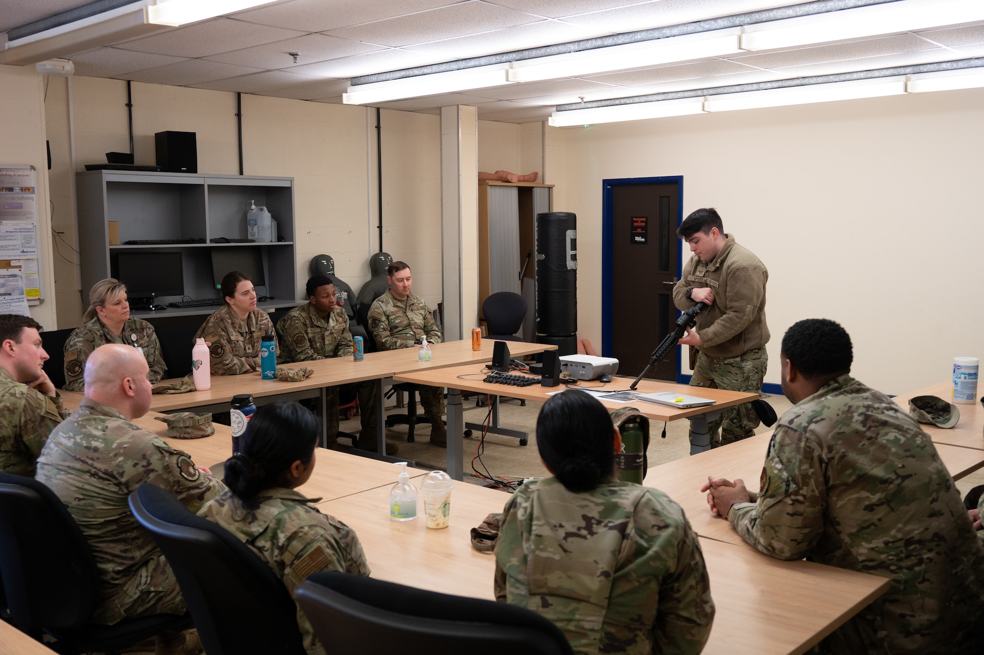 U.S. Air Force Staff Sgt. Leonard Myers, 423rd Security Forces Squadron Armory non-commissioned officer in charge, demonstrates parts of a rifle